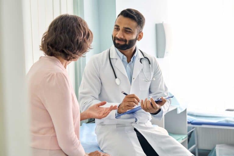 A physician speaking with a patient